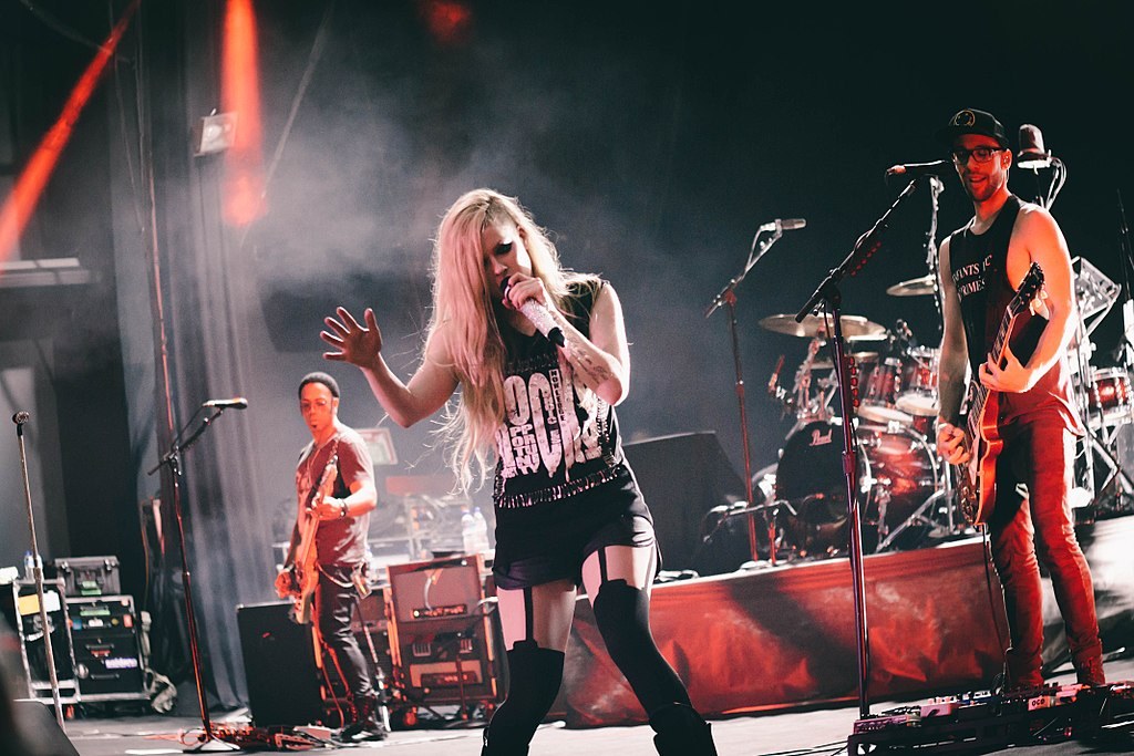 A photo of Avril Lavigne from 2014 when she was singing on stage in Brazil.